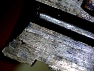 A series of scratches and a well-defined tension tool mark found inside of the plug.