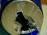 Heavy damage to the front of the lock and the keyway profile caused by a screwdriver or chisel type tool.